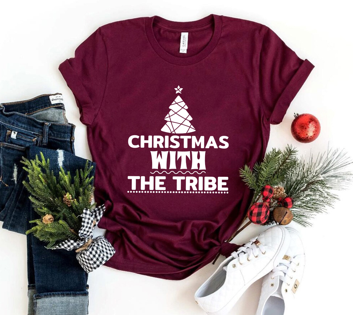 A festive unisex T-shirt featuring a Christmas design, made from soft ring spun cotton, available in multiple colors and sizes.