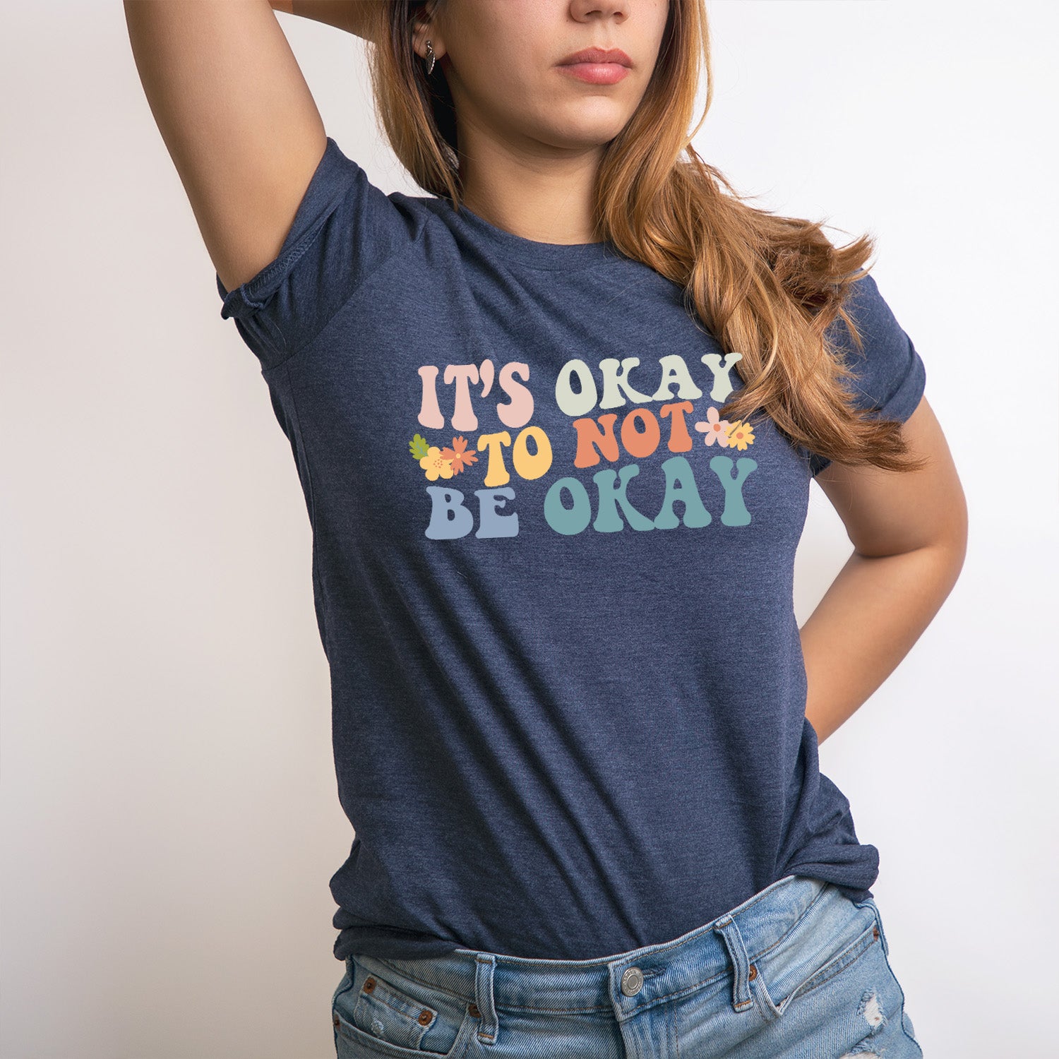 Colorful It's Okay Not To Be Okay T-shirt featuring vibrant design and comfortable fabric, promoting mental health awareness.