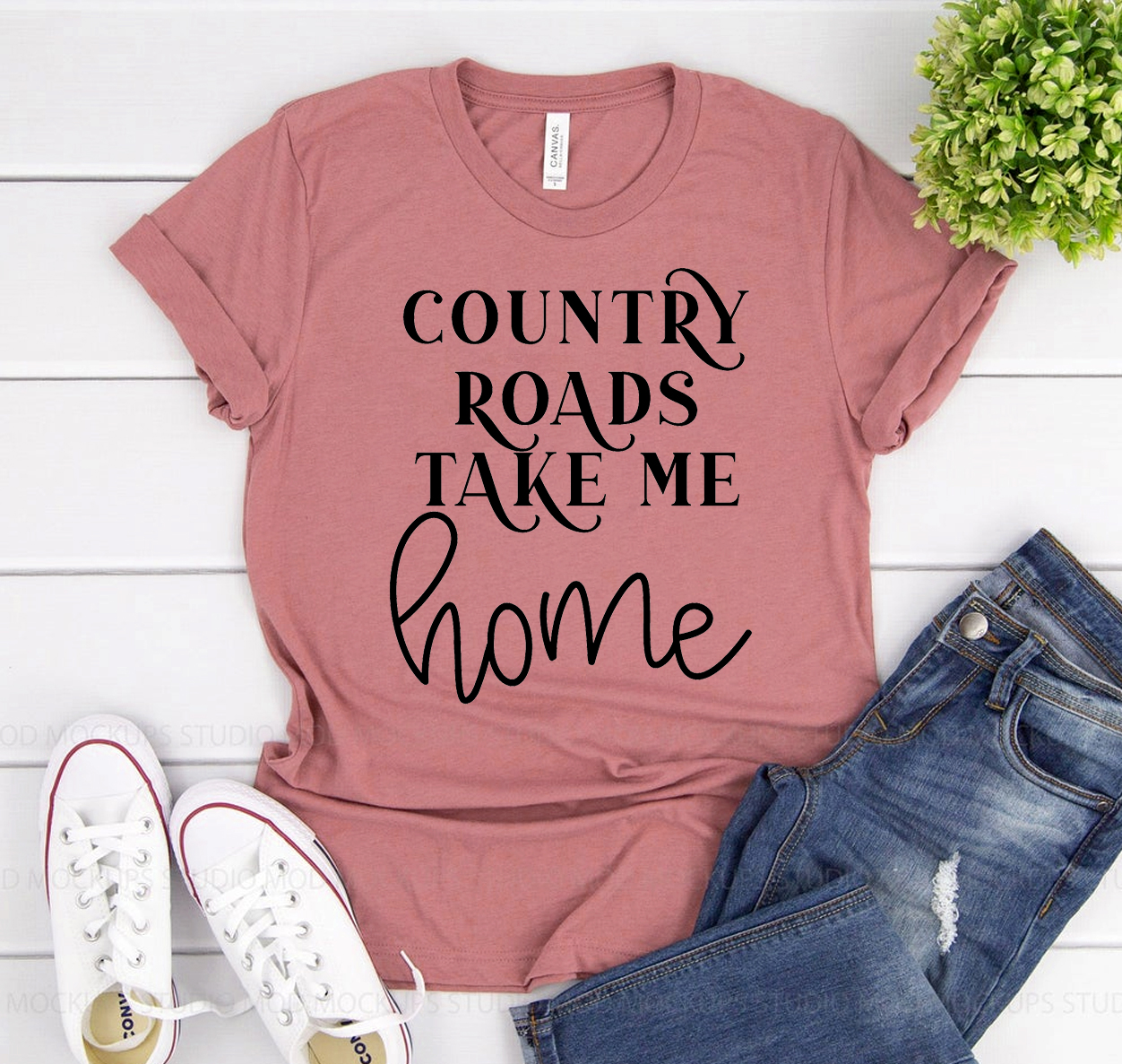 A classic unisex Bella Canvas 3001 tee featuring the phrase 'Country Roads Take Me Home' in a stylish font, made from soft airlume cotton.