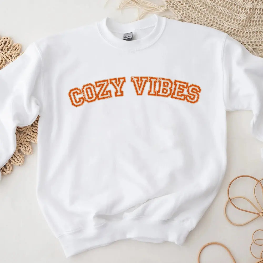 Cozy Vibes Fall Sweatshirt in a warm autumn color, showcasing its comfortable fit and stylish design, perfect for casual wear.