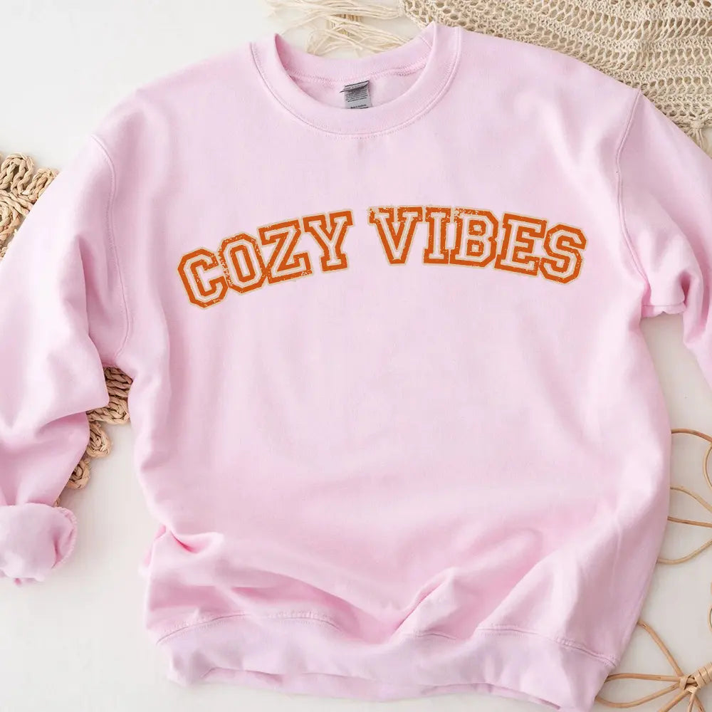 Cozy Vibes Fall Sweatshirt in a warm autumn color, showcasing its comfortable fit and stylish design, perfect for casual wear.