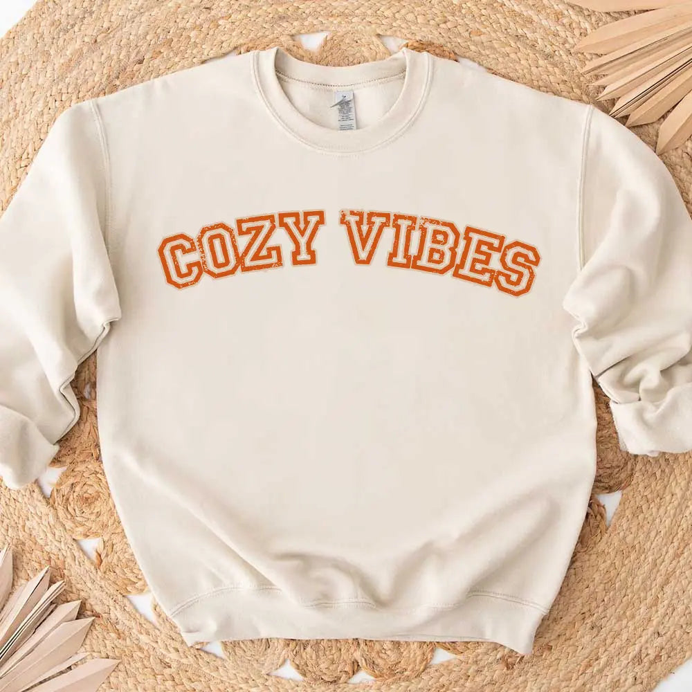 Cozy Vibes Fall Sweatshirt in a warm autumn color, showcasing its comfortable fit and stylish design, perfect for casual wear.