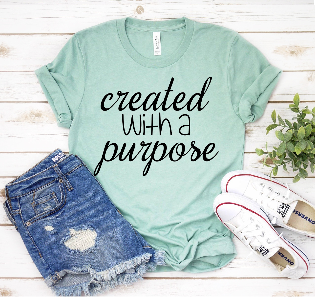 Created With A Purpose T-shirt in various sizes, showcasing its soft fabric and classic unisex design.