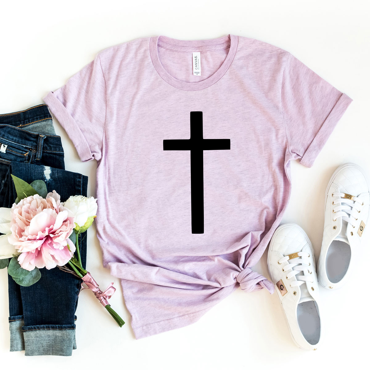 A unisex Cross Shirt made from soft ring spun cotton, available in multiple colors and sizes, featuring a classic crew neck and short sleeves.