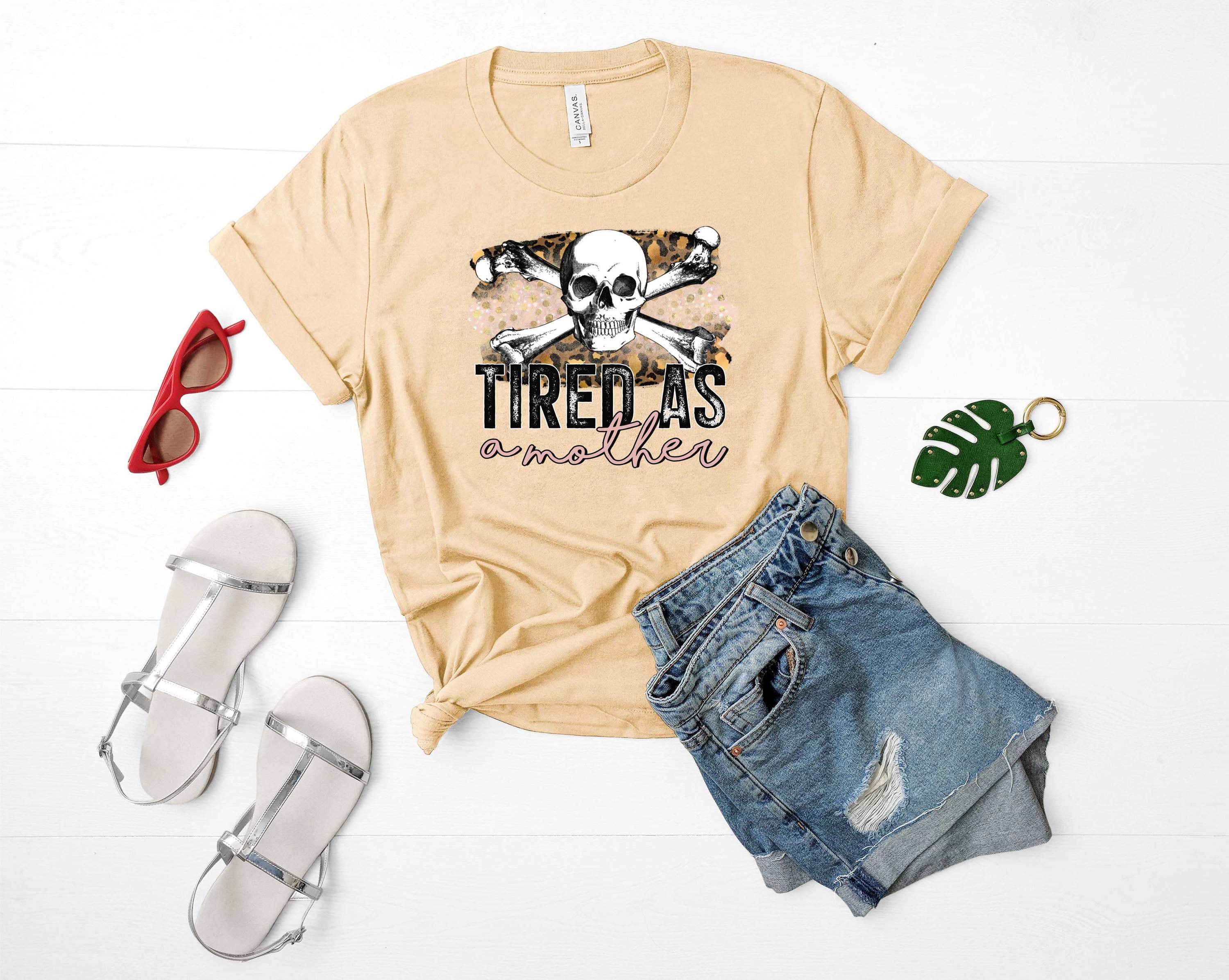 Crossbone 'Tired as a Mother' Graphic Tee featuring a humorous design, perfect for casual wear.