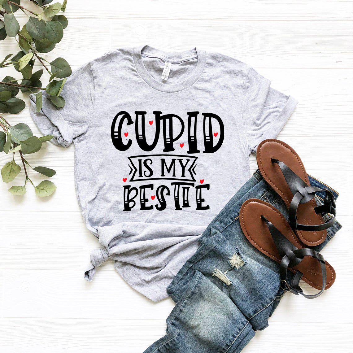 A stylish unisex T-shirt featuring the phrase 'Cupid Is My Bestie' in vibrant print, made from soft ring spun cotton.