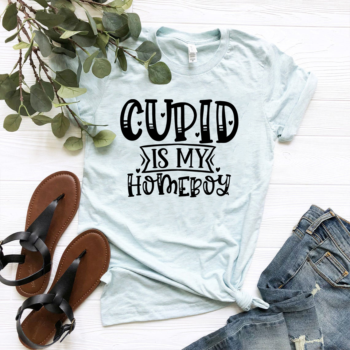 A unisex Cupid Is My Homeboy shirt in various colors, showcasing its comfortable fit and stylish design.