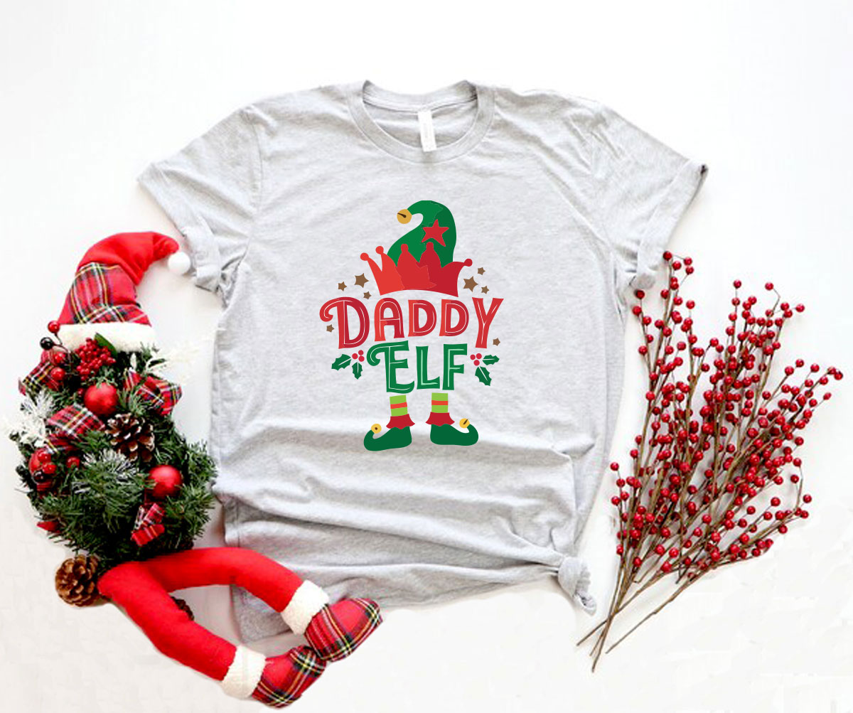 A festive Daddy Elf Shirt made from soft ring spun cotton, featuring a classic crew neck and short sleeves, available in multiple colors.