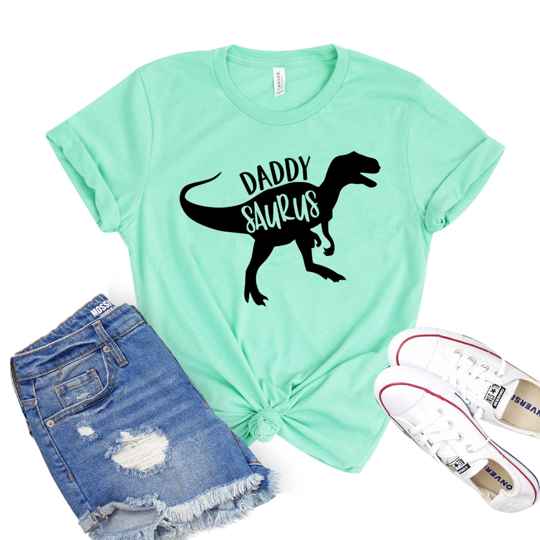 Daddy Saurus T-shirt featuring a fun dinosaur graphic on a classic unisex tee, made from soft cotton fabric.