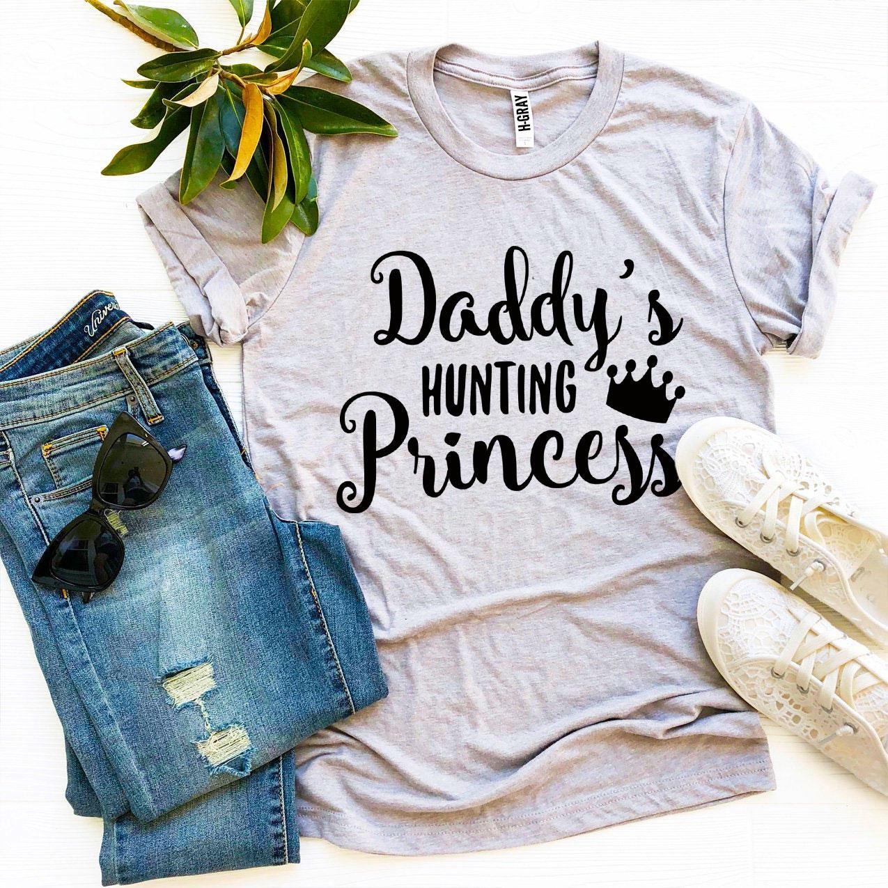 A stylish Daddy’s Hunting Princess T-shirt made from premium ring spun cotton, featuring a playful hunting princess design.