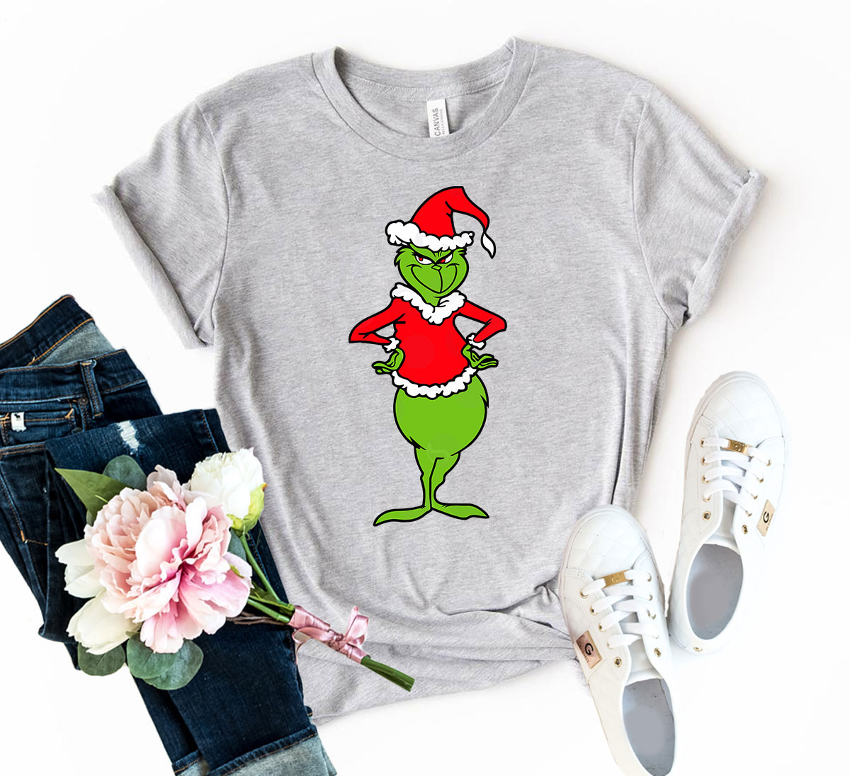 A vibrant Dancing Grinch Shirt featuring a whimsical Grinch design, made from soft ring spun cotton, available in multiple colors.