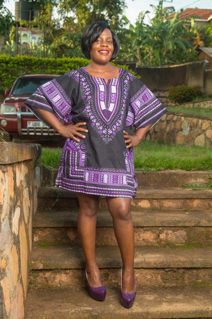 Dashiki African Festival Black Shirt featuring vibrant handmade print in black, yellow, and orange colors, made from 100% cotton.