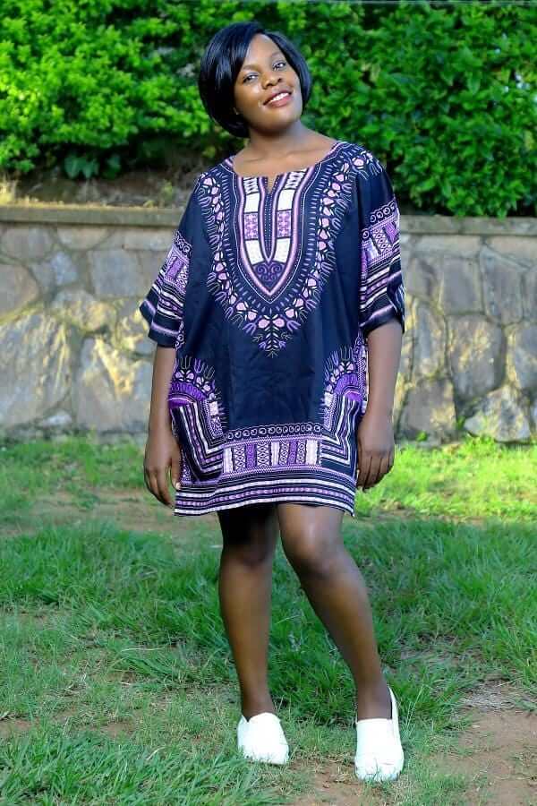 Dashiki African Festival Black Shirt featuring vibrant handmade print in black, yellow, and orange colors, made from 100% cotton.