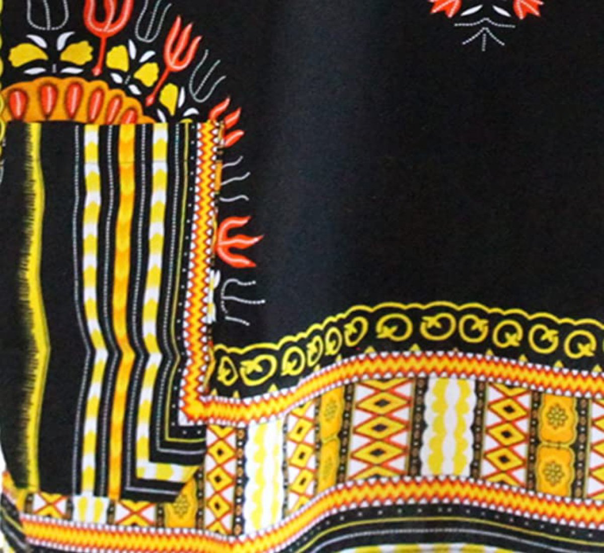 A vibrant Dashiki African Shirt made from 100% cotton, featuring intricate patterns and a unique design that looks the same on both sides.