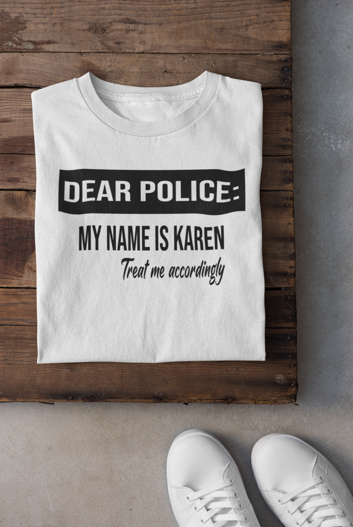 A humorous unisex shirt featuring the phrase 'Dear Police, My Name is Karen, Treat Me Accordingly' printed on a soft cotton fabric.