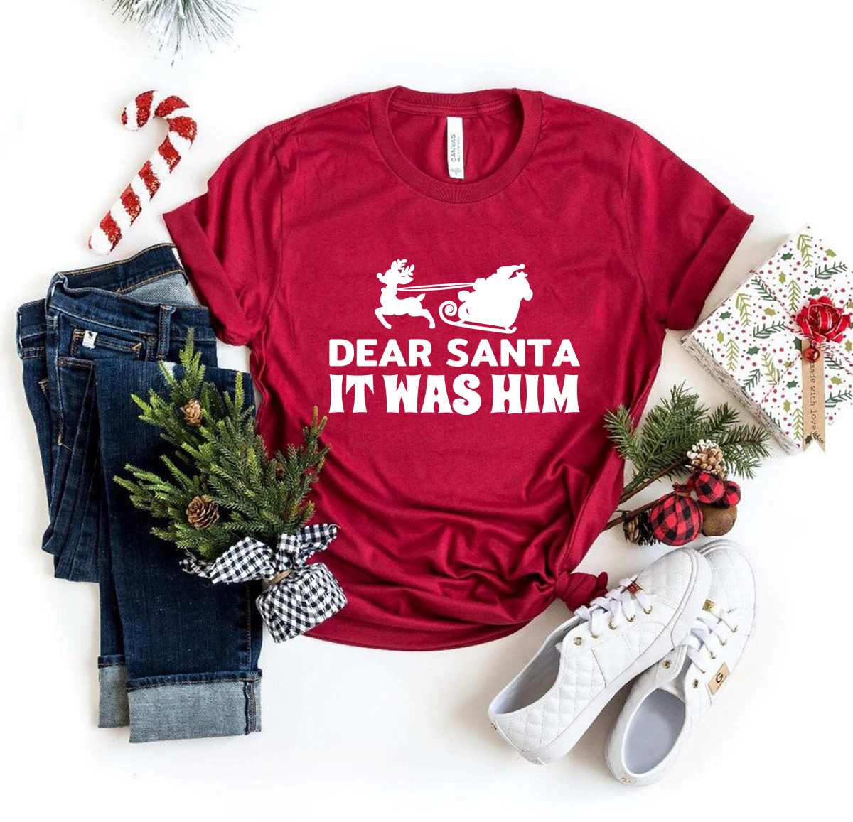 A festive unisex T-shirt featuring the phrase 'Dear Santa It Was Him' in a stylish print, made from soft ring spun cotton.