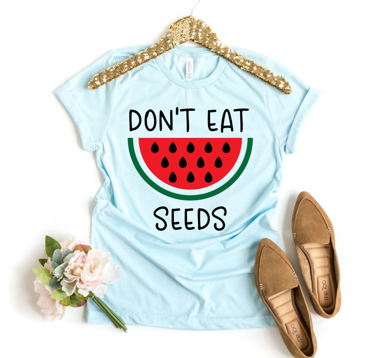 A stylish Don’t Eat Watermelon Seeds T-shirt made from premium ring spun cotton, featuring a playful print.