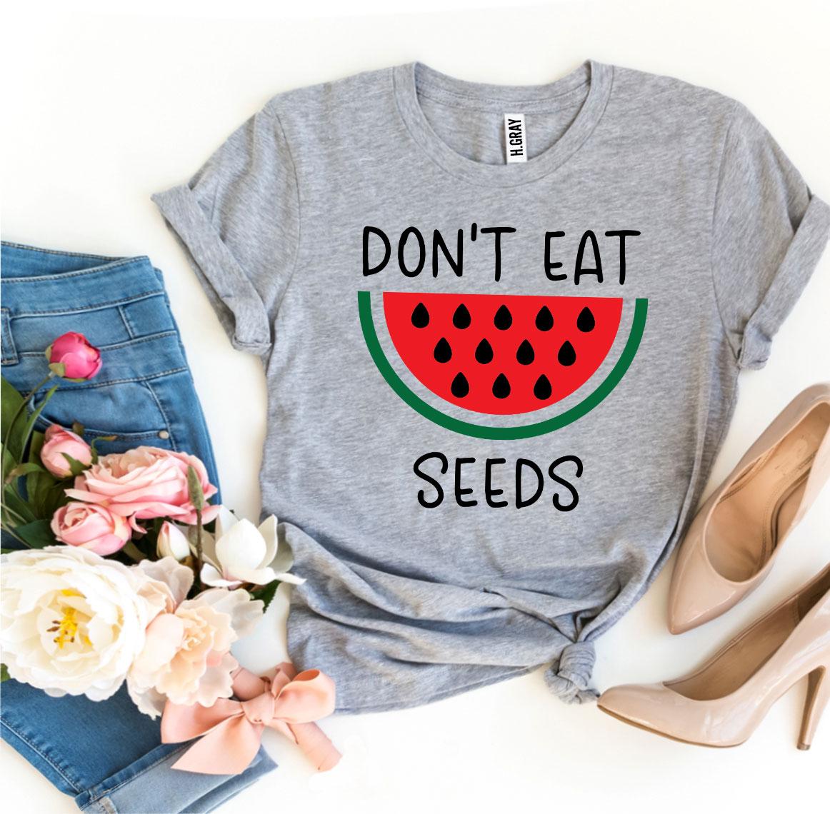 Don’t Eat Watermelon Seeds T-shirt made of soft ring spun cotton with a playful design, available in various sizes.