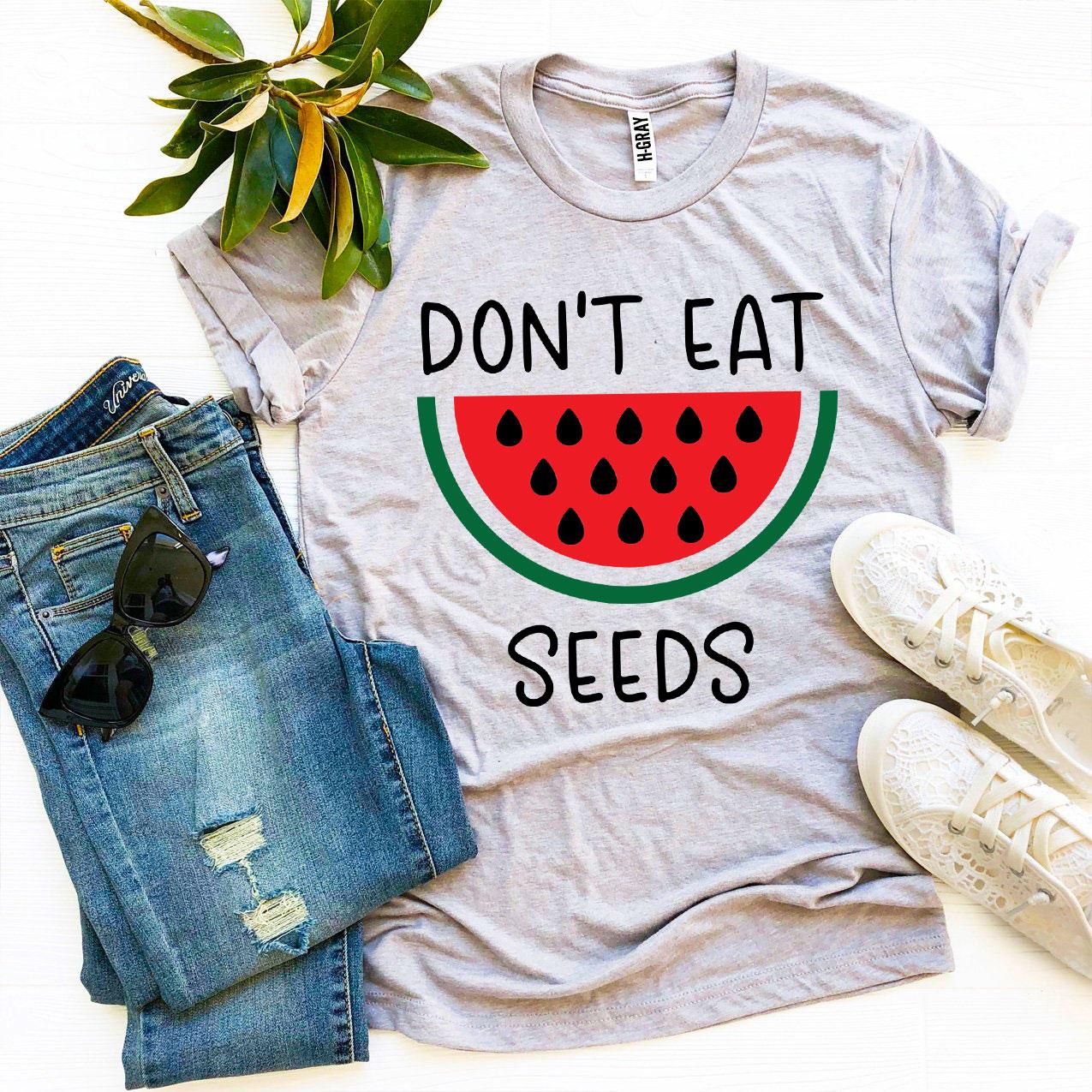 Don’t Eat Watermelon Seeds T-shirt made of soft ring spun cotton with a playful design, available in various sizes.