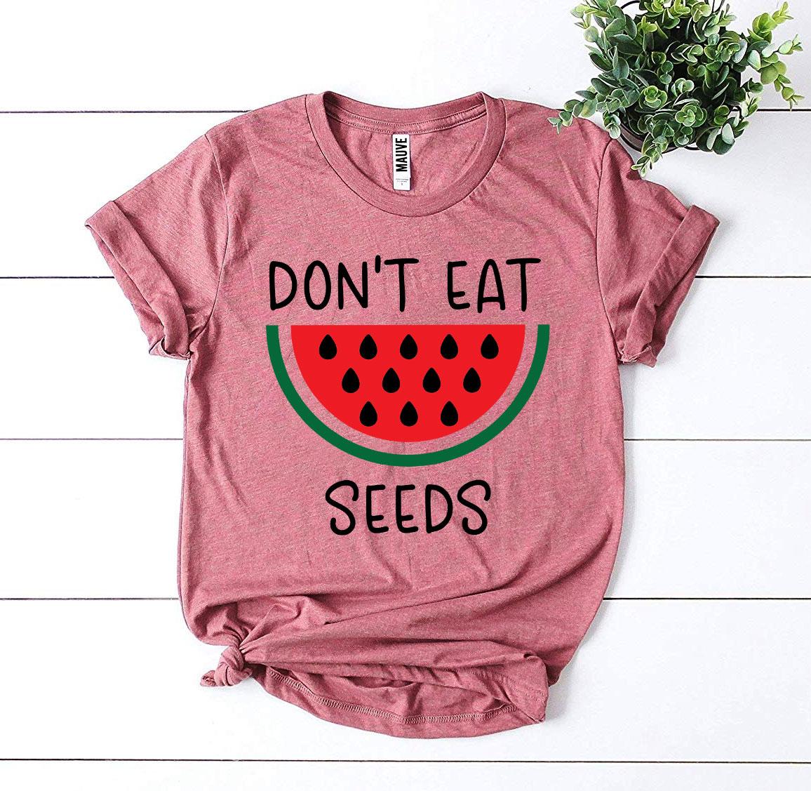 Don’t Eat Watermelon Seeds T-shirt made of soft ring spun cotton with a playful design, available in various sizes.