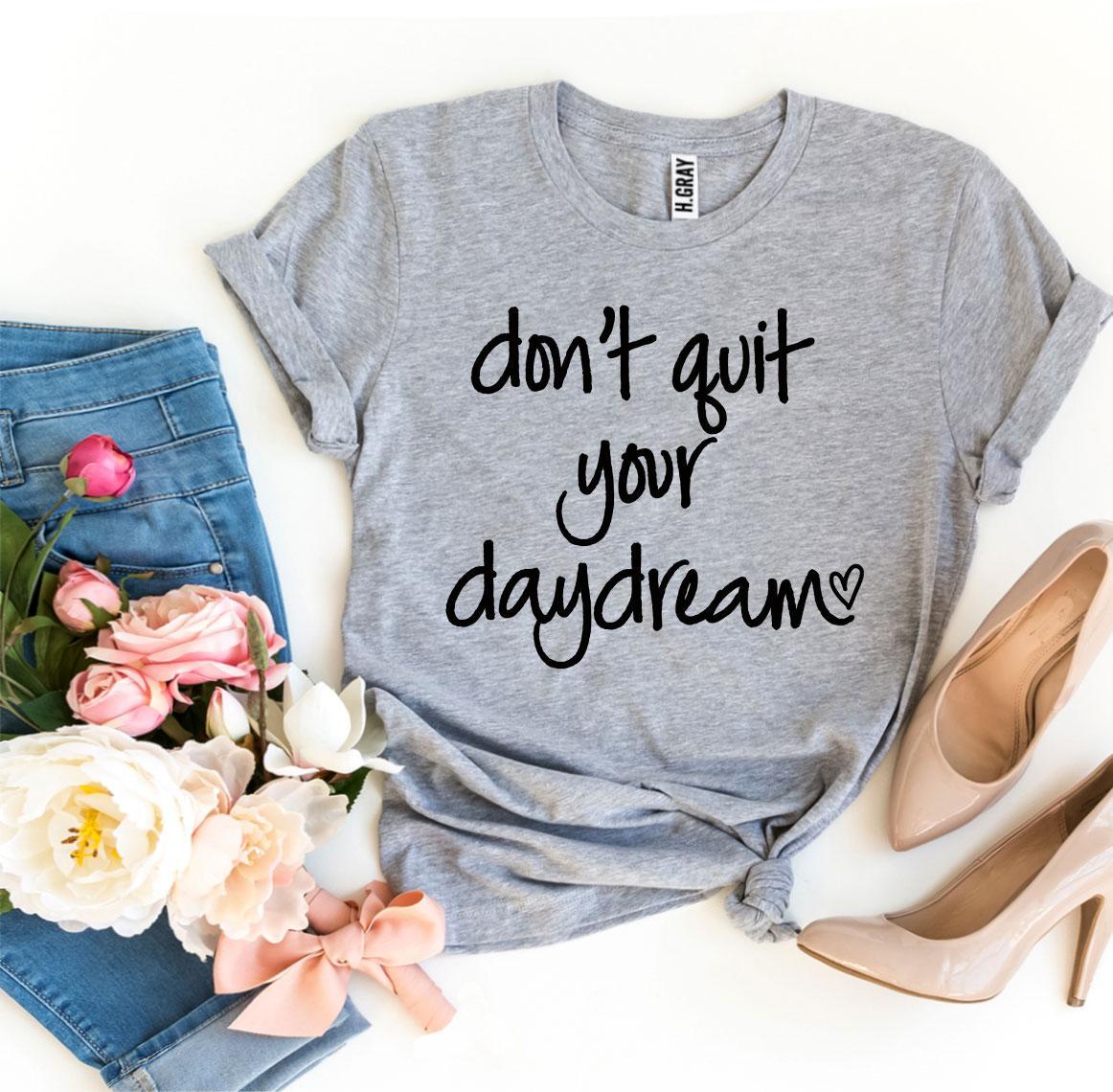 Don’t Quit Your Daydream T-shirt made of premium ring spun cotton with a motivational print, available in various sizes.