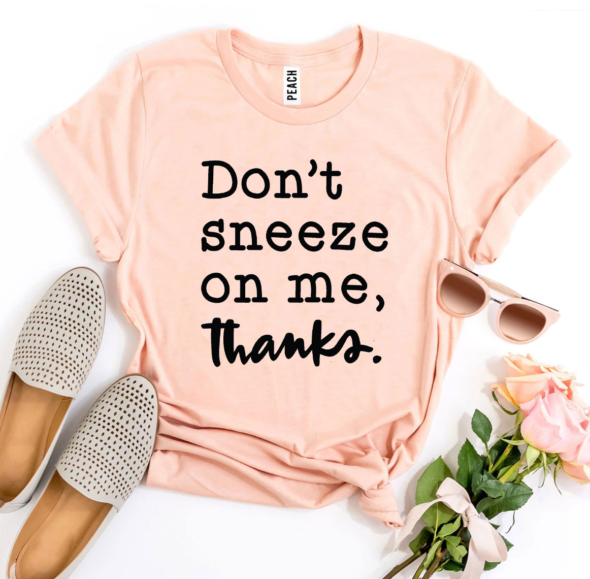 Don't Sneeze On Me T-shirt made from premium ring spun cotton with a striking design and soft textile flex print.