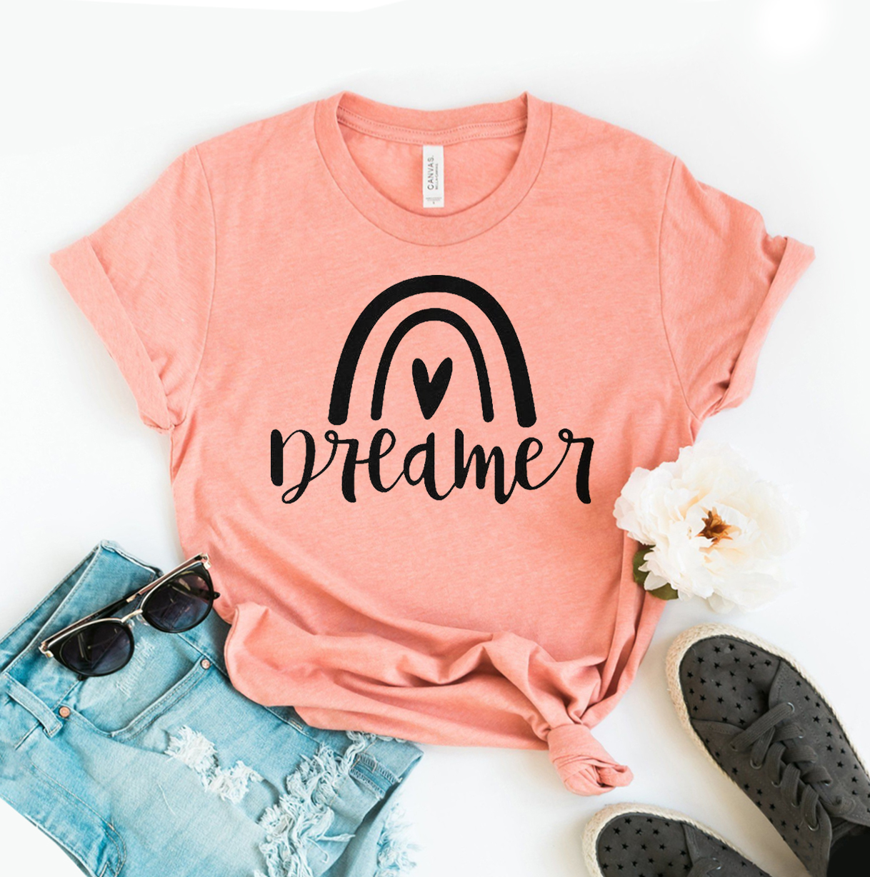 Dreamer T-shirt made of premium ring spun cotton, featuring a soft textile flex print design in various sizes.