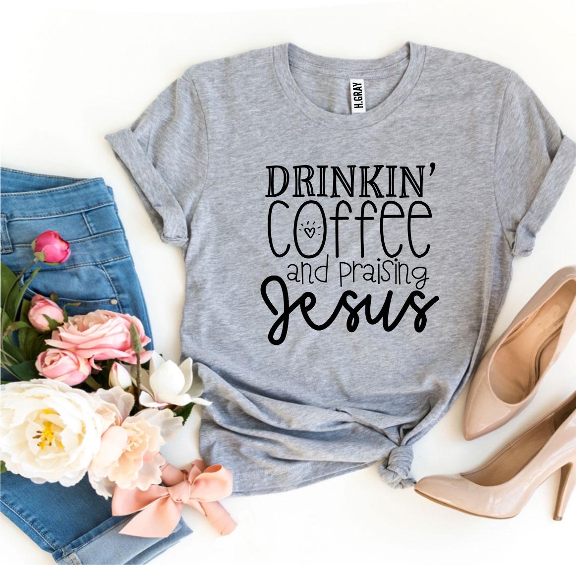 Drinkin’ Coffee And Praising Jesus T-shirt in various sizes, showcasing its soft cotton fabric and vibrant flex print design.