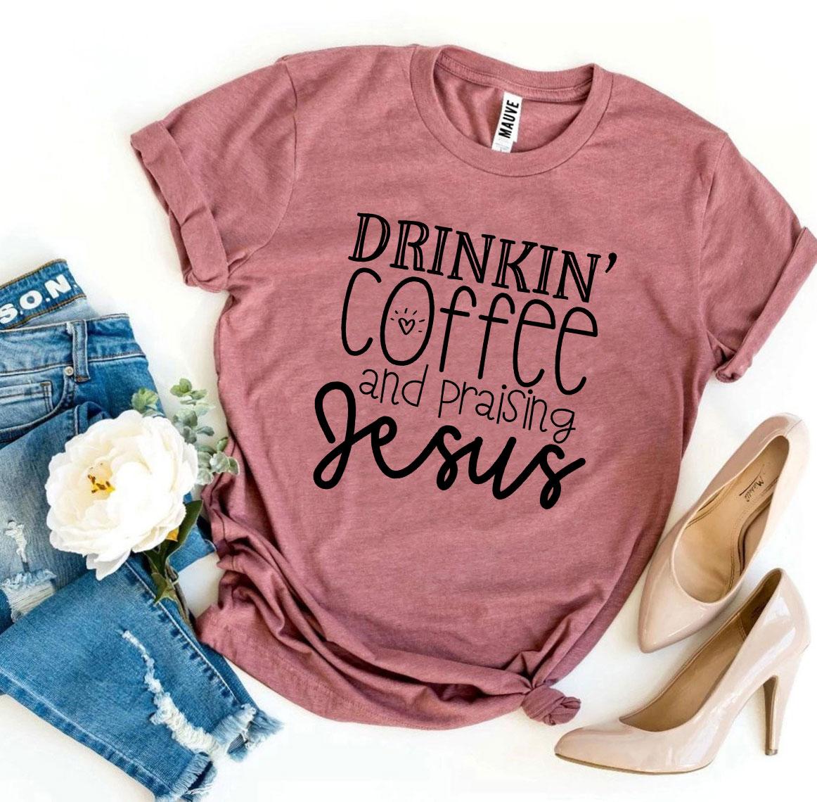 Drinkin’ Coffee And Praising Jesus T-shirt in various sizes, showcasing its soft cotton fabric and vibrant flex print design.