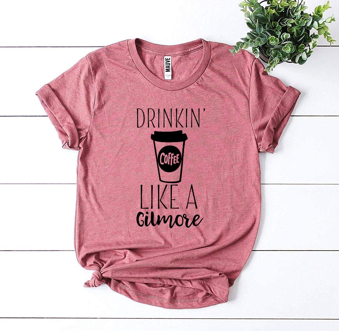 Drinkin’ Coffee Like a Gilmore T-shirt made of premium ring spun cotton with a stylish coffee-themed design.