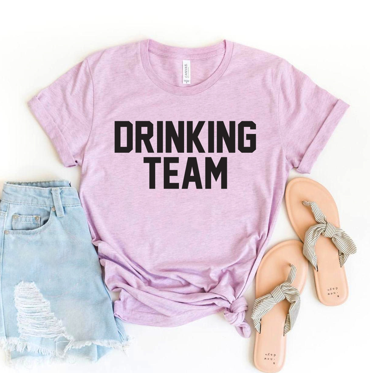 A stylish Drinking Team T-shirt made of premium ring spun cotton, featuring a vibrant flex print design, available in various sizes.