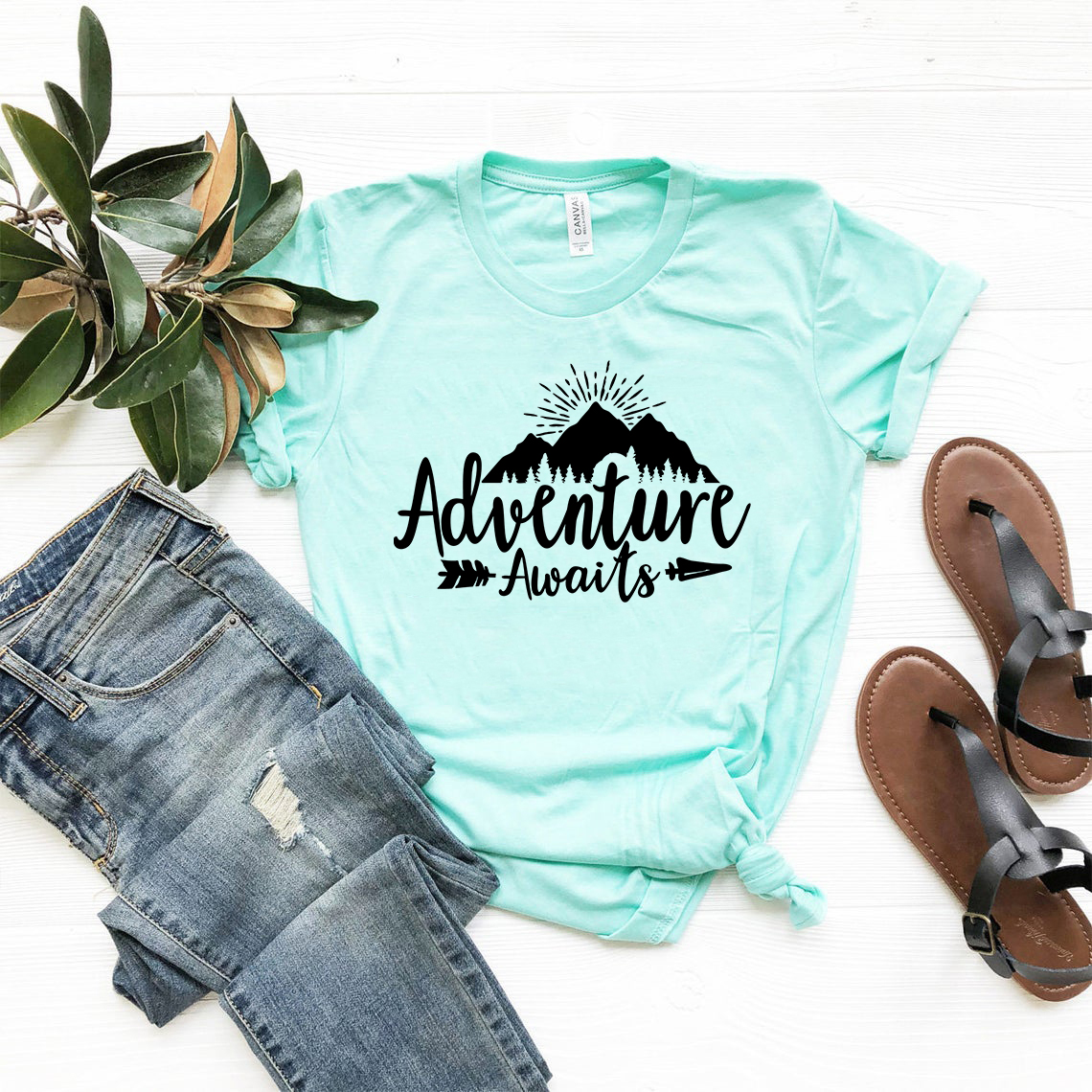 DT0552 Adventure Awaits Unisex T-shirt in various colors, showcasing its soft fabric and stylish design.