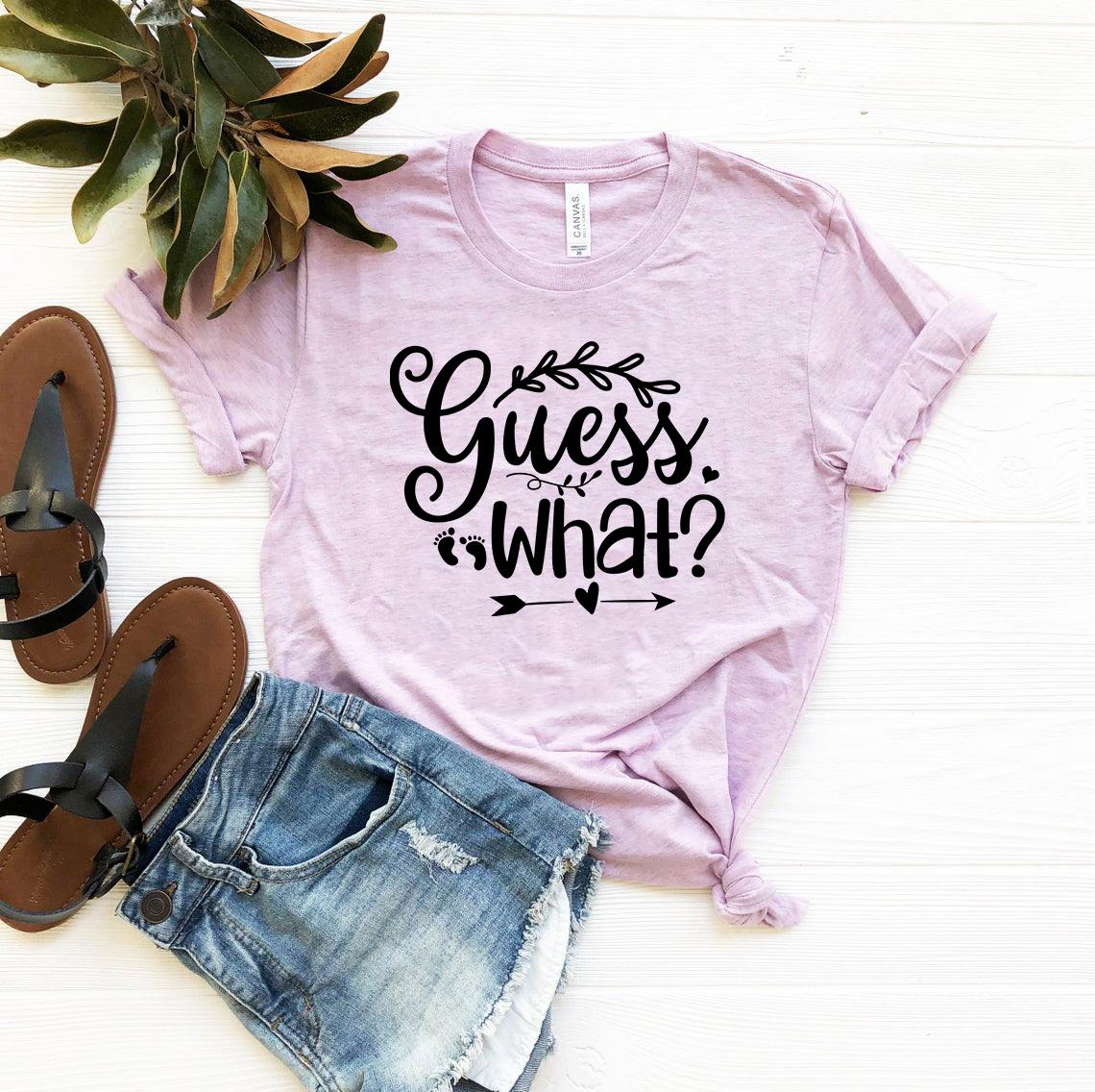 DT0641 Guess What 2 Unisex T-shirt in various colors, showcasing its soft fabric and stylish design.