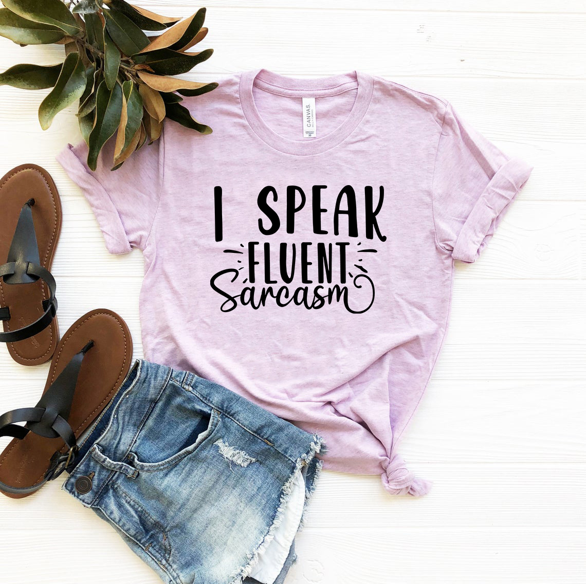 DT0659 Unisex T-shirt featuring the phrase 'I Speak Fluent Sarcasm' in a stylish design, available in multiple colors.