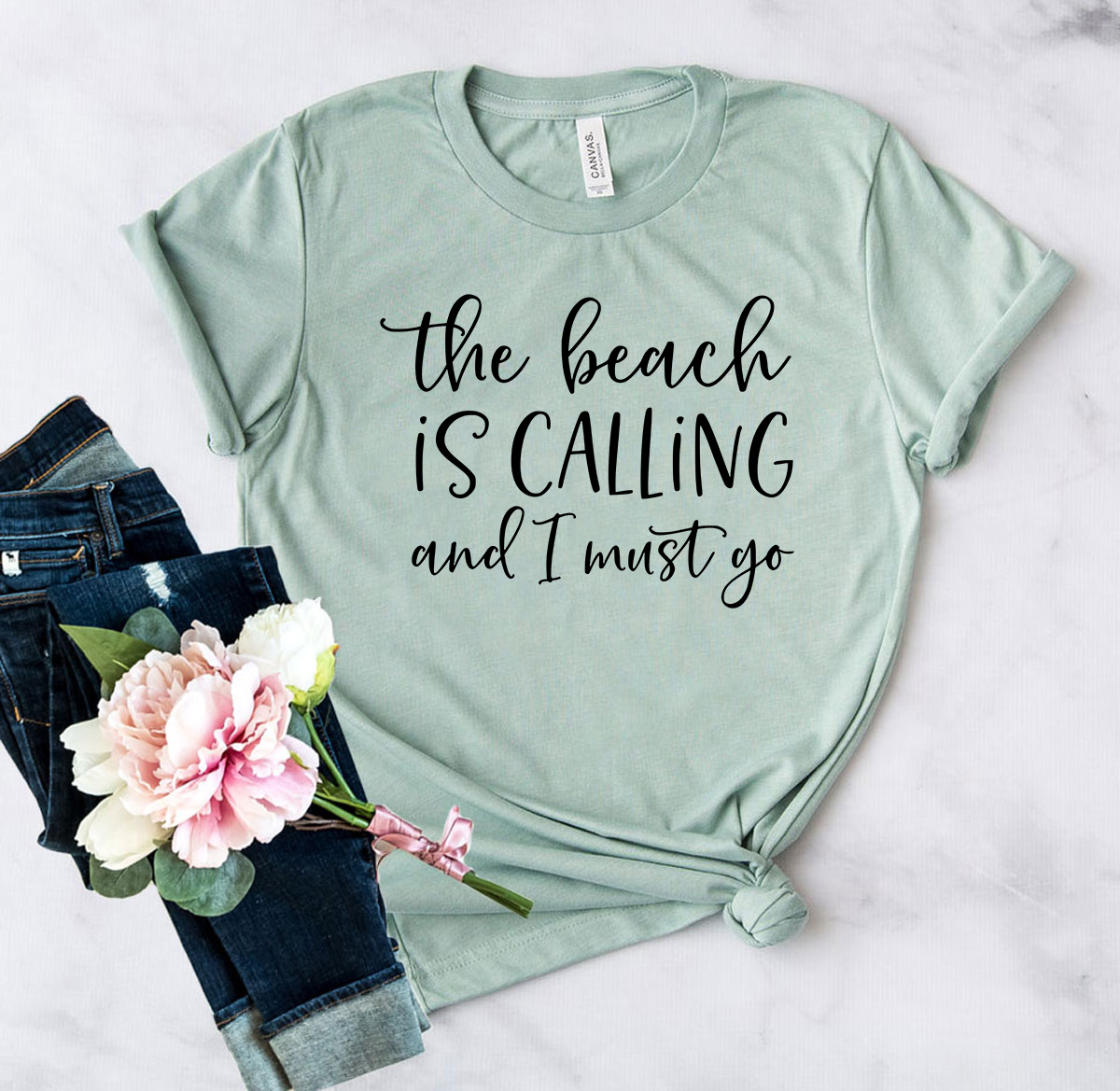 DT0067 The Beach Is Calling And I Must Go Shirt in various colors, showcasing its soft fabric and stylish design.