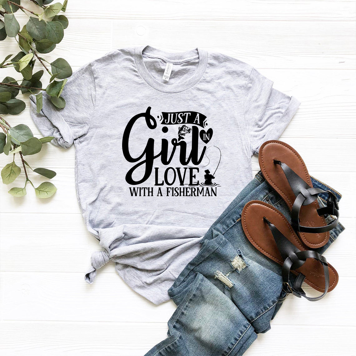 Unisex T-shirt featuring 'Just A Girl In Love With A Fisherman' design, made from soft ring spun cotton, available in multiple colors.