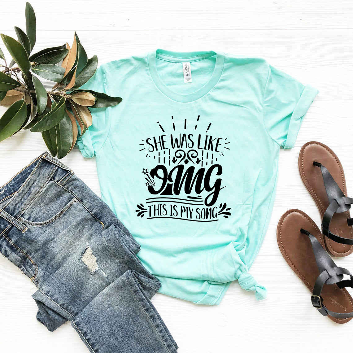 DT0869 Unisex T-shirt featuring the phrase 'She was like omg this is my song', made from soft ring spun cotton, available in multiple colors.