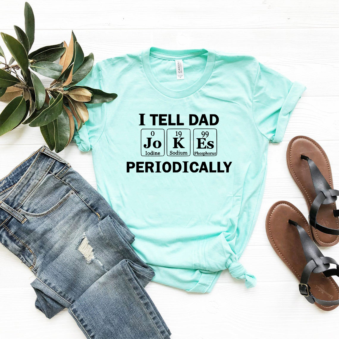 DT0948 I Tell Jokes Periodically Unisex T-shirt in various colors, showcasing its soft fabric and humorous print.