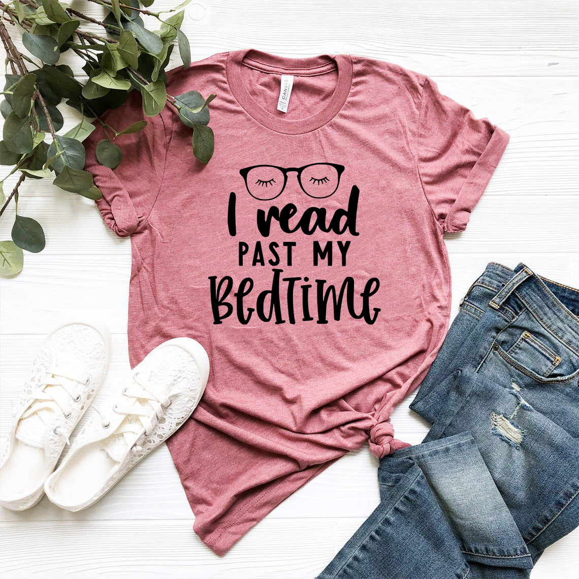 Unisex T-shirt featuring the phrase 'I Read Past My Bedtime' in a stylish print, made from soft ring spun cotton, available in multiple colors.