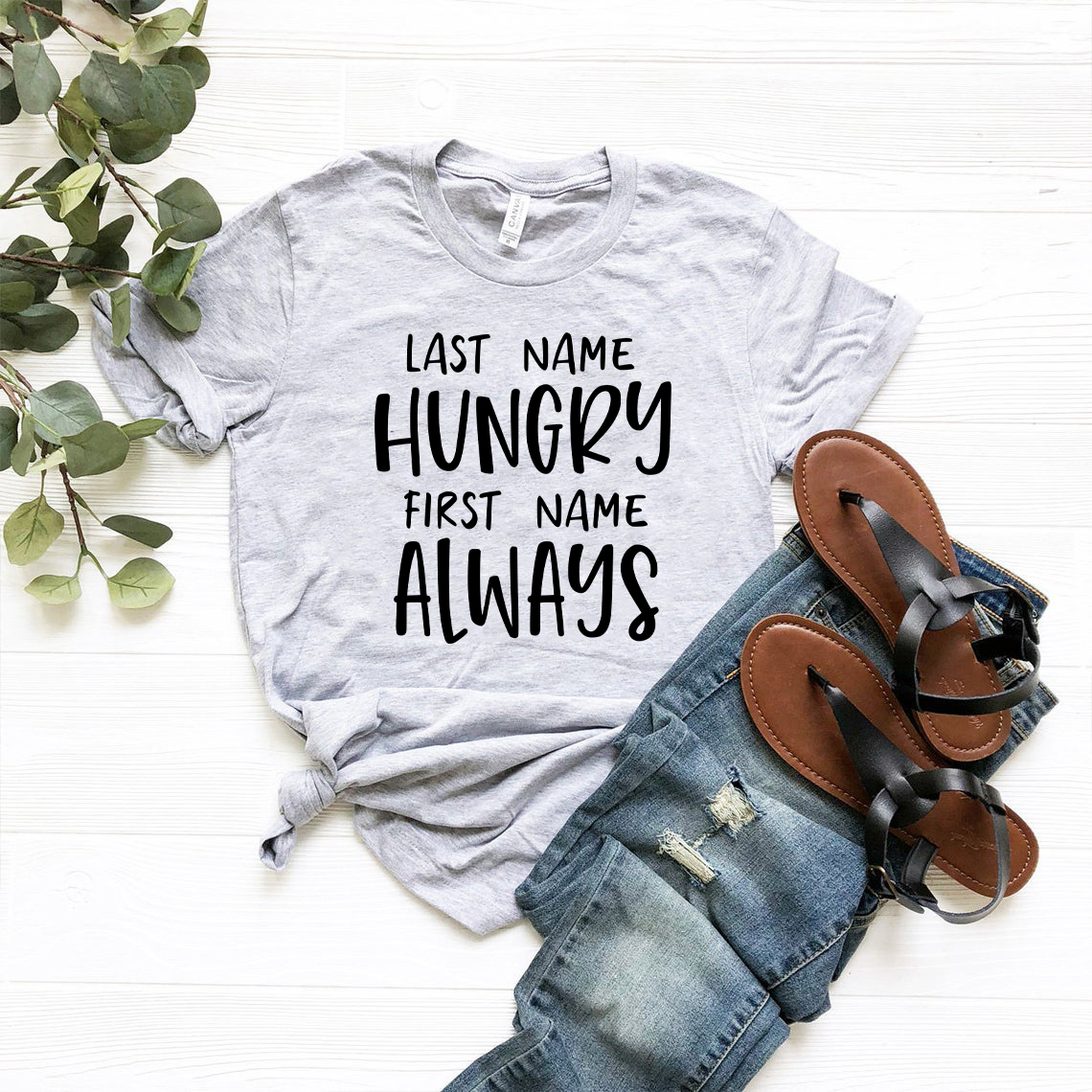 DT0964 Last Name Hungry First Name Always unisex T-shirt in various colors, showcasing its soft fabric and stylish design.