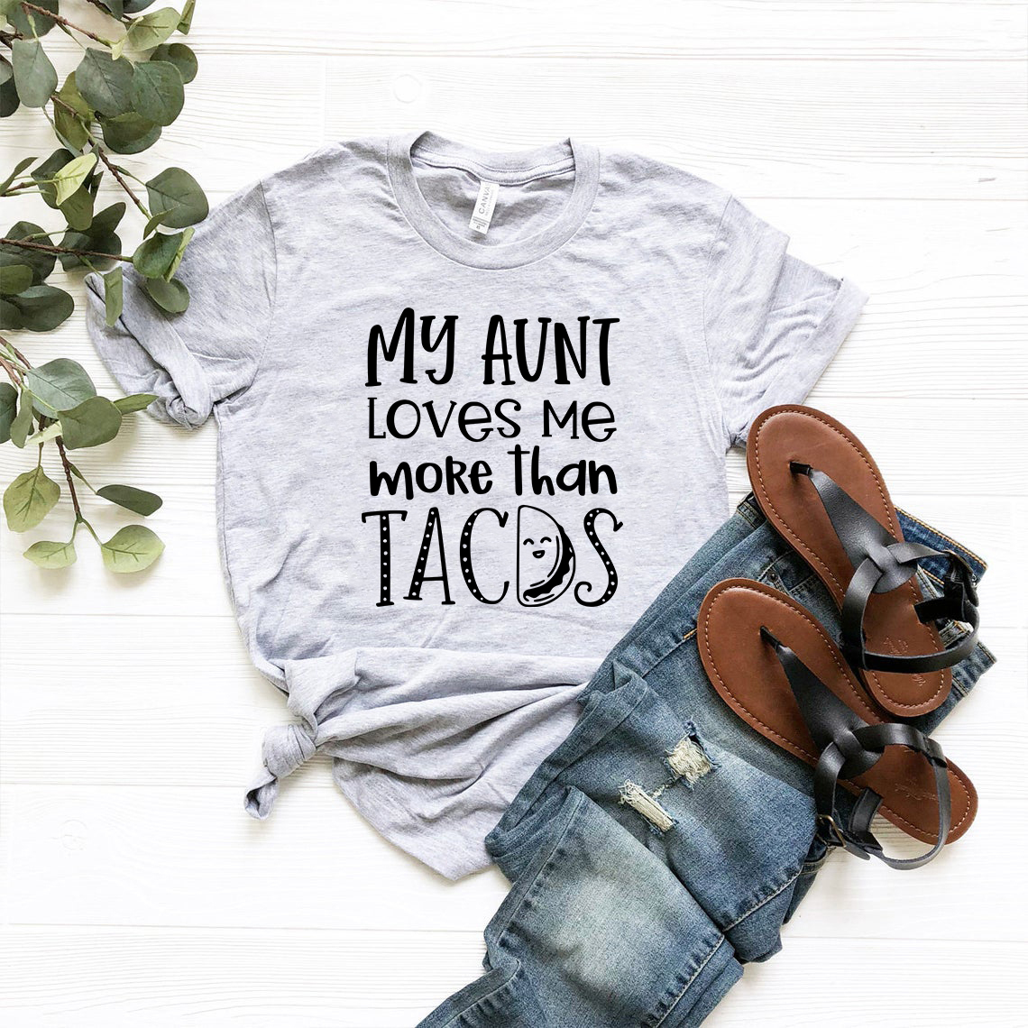 DT0977 My Aunt Loves Me More Than Tacos T-shirt in various colors, showcasing its soft fabric and humorous design.