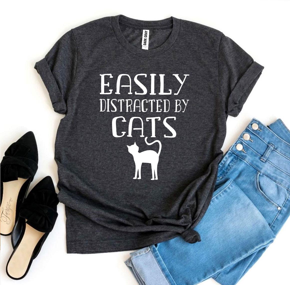 Easily Distracted By Cats T-shirt in various sizes, showcasing its soft cotton fabric and vibrant print design.