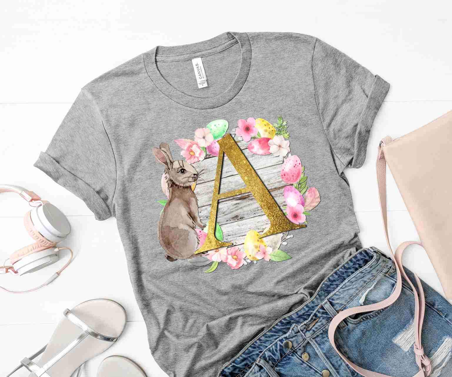 Easter Bunny Floral Letter Graphic Tee featuring a colorful bunny design with floral elements on a soft fabric.