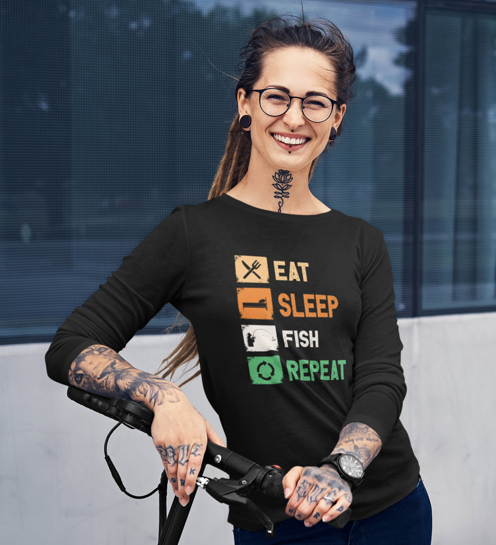 Women wearing a long sleeve shirt with 'Eat Sleep Fishing Repeat' design, showcasing a casual and stylish look.