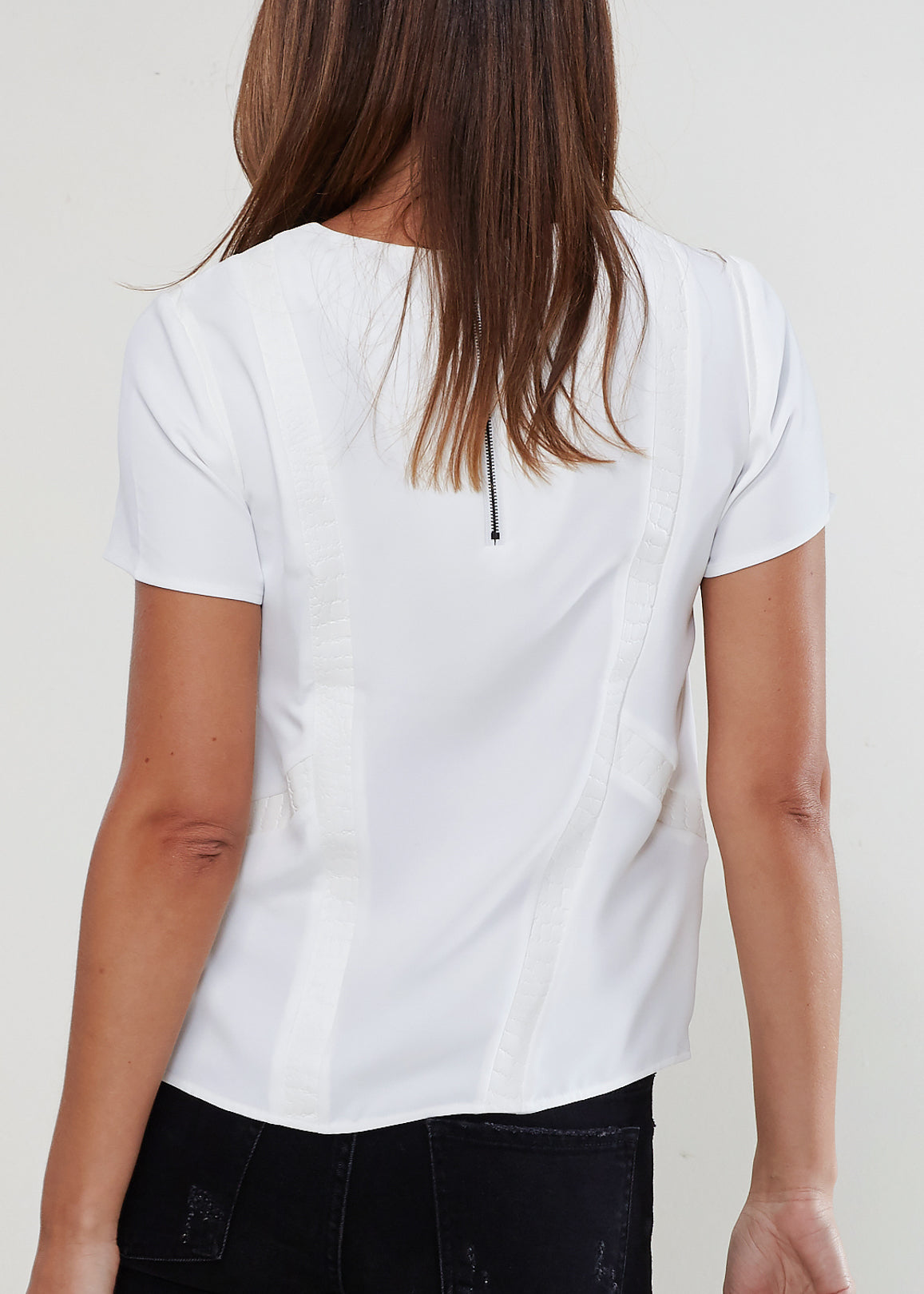 Essential Back Zip Crew Neck Tee in soft polyester with stylish back zip detail, showcasing a modern round hem design.