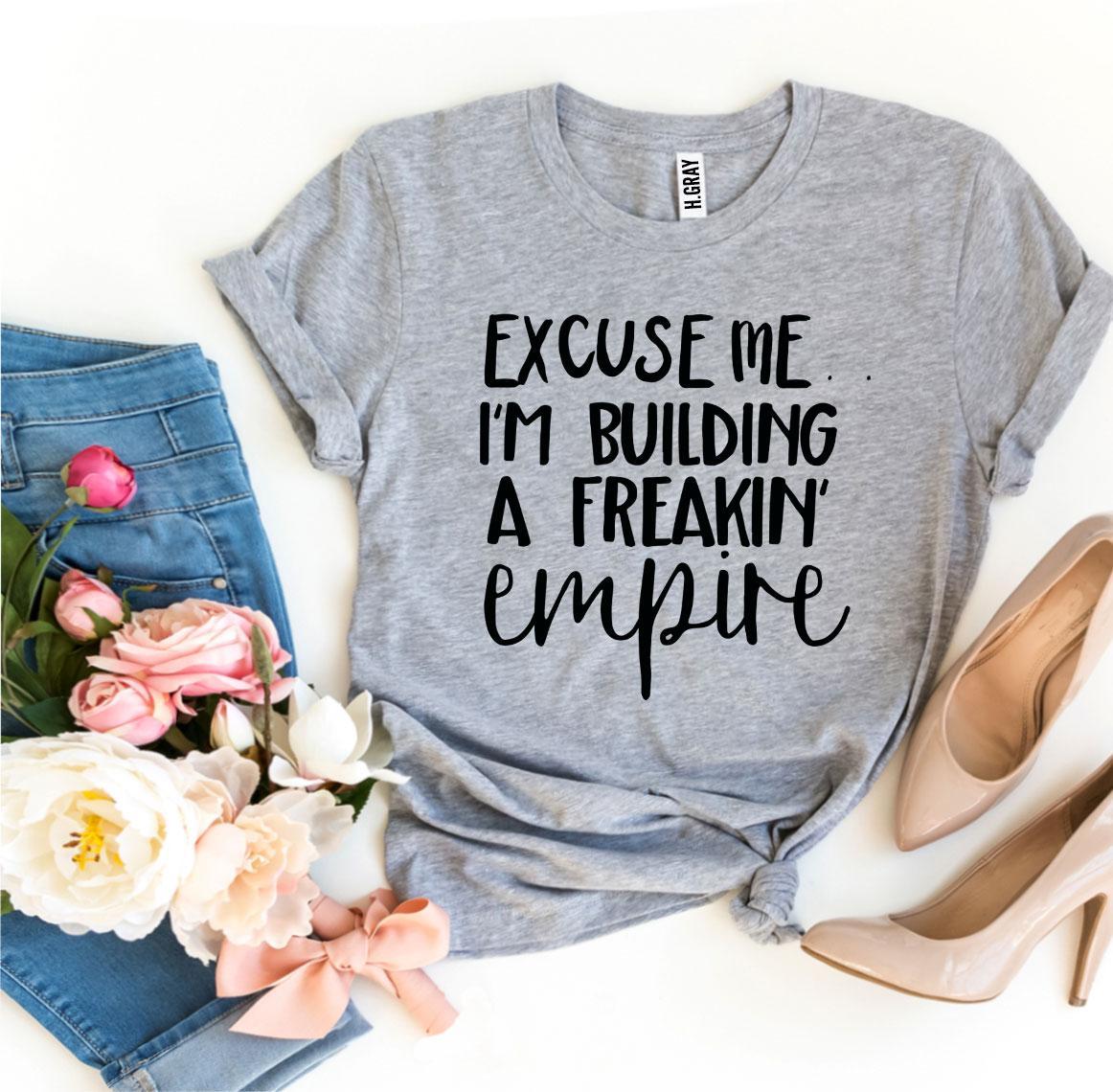 Excuse Me I’m Building a Freakin’ Empire T-shirt in premium ring spun cotton, featuring a bold flex print design.