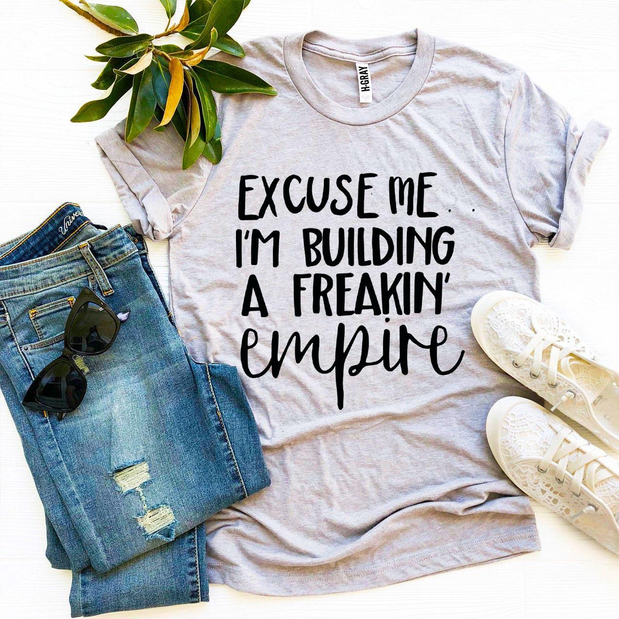 Excuse Me I’m Building a Freakin’ Empire T-shirt in premium ring spun cotton, featuring a bold flex print design.