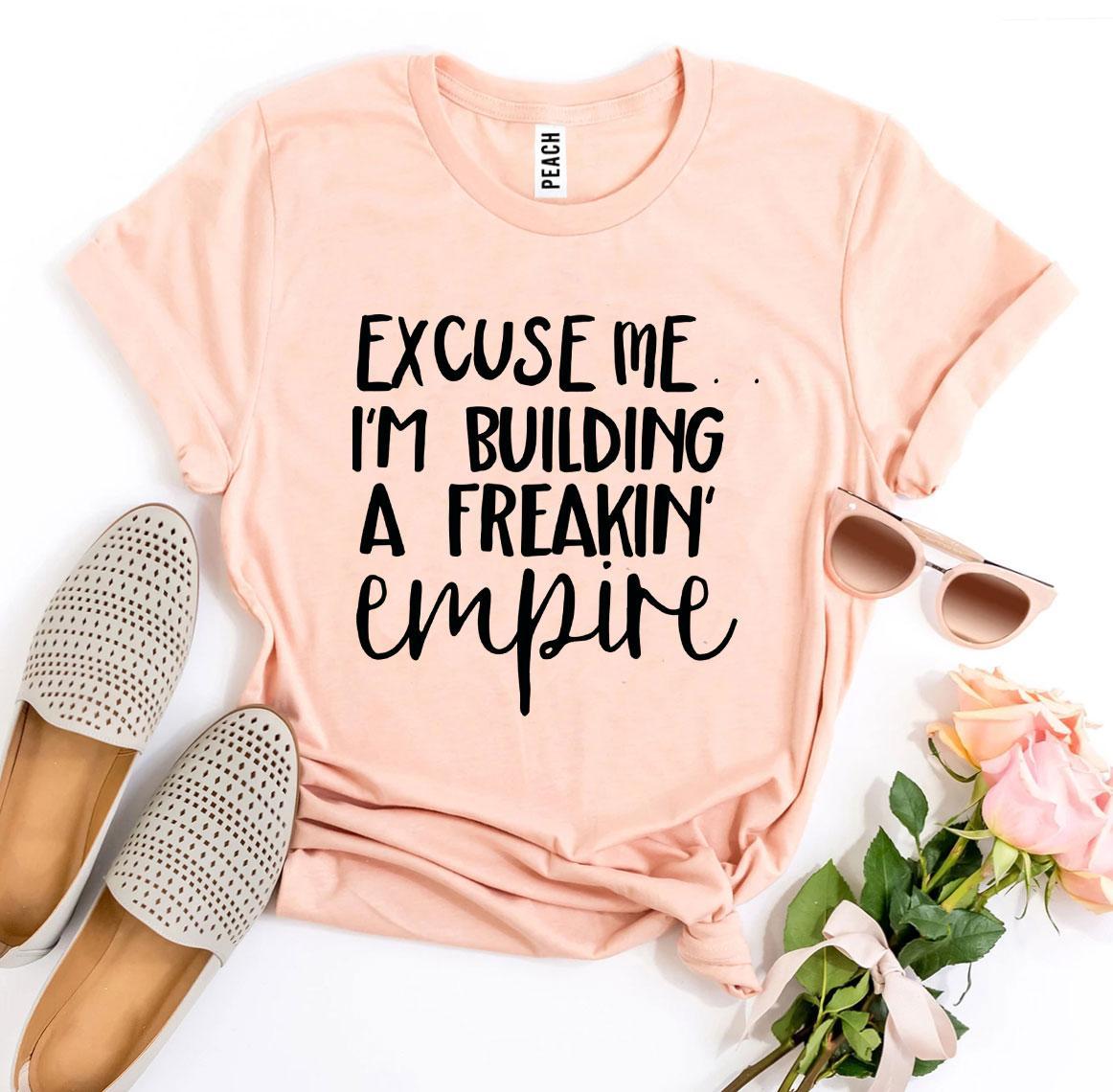 Excuse Me I’m Building a Freakin’ Empire T-shirt in premium ring spun cotton, featuring a bold flex print design.