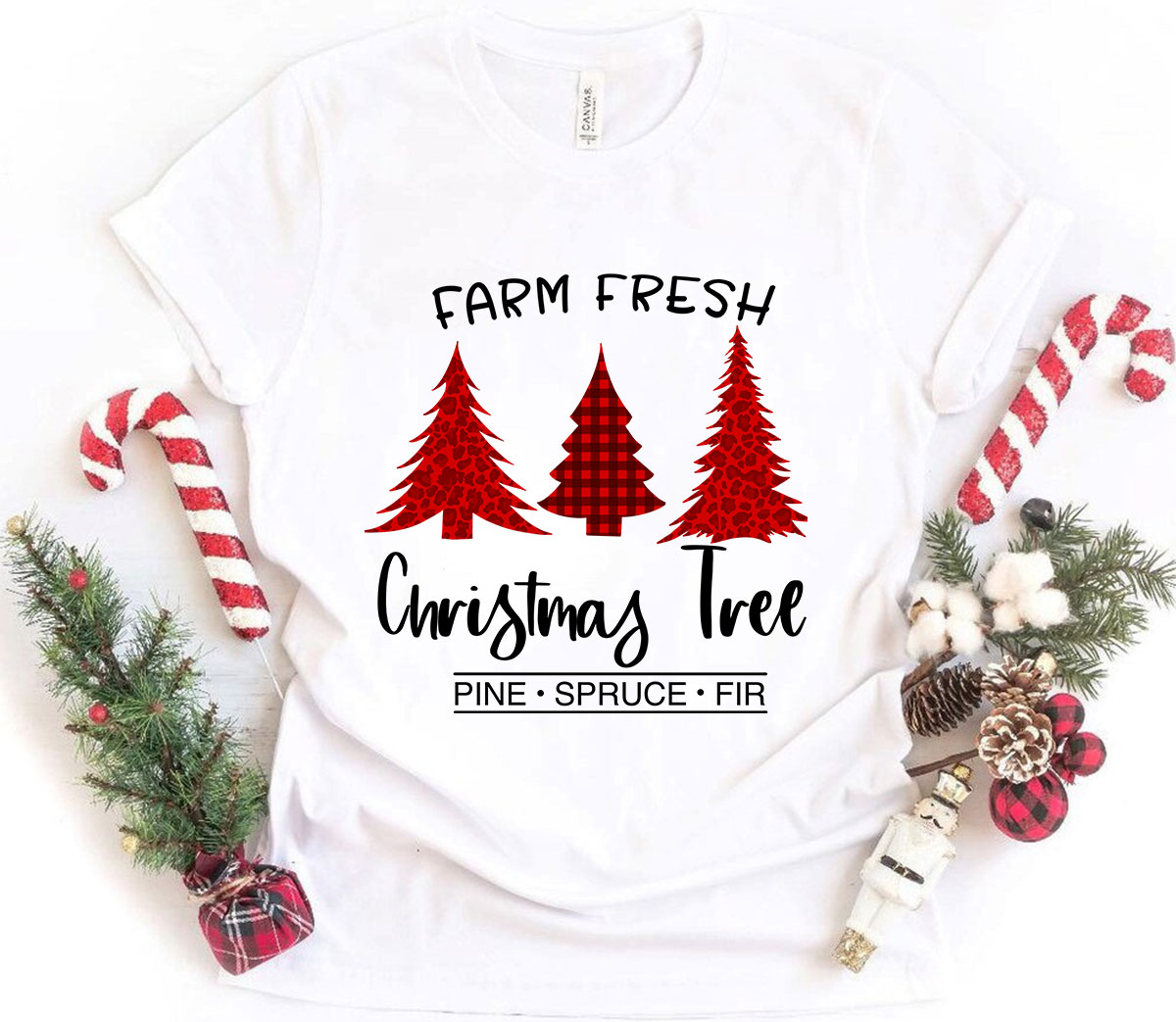 A festive unisex T-shirt featuring a Farm Fresh Christmas Tree design, made from soft ring-spun cotton, available in multiple colors.