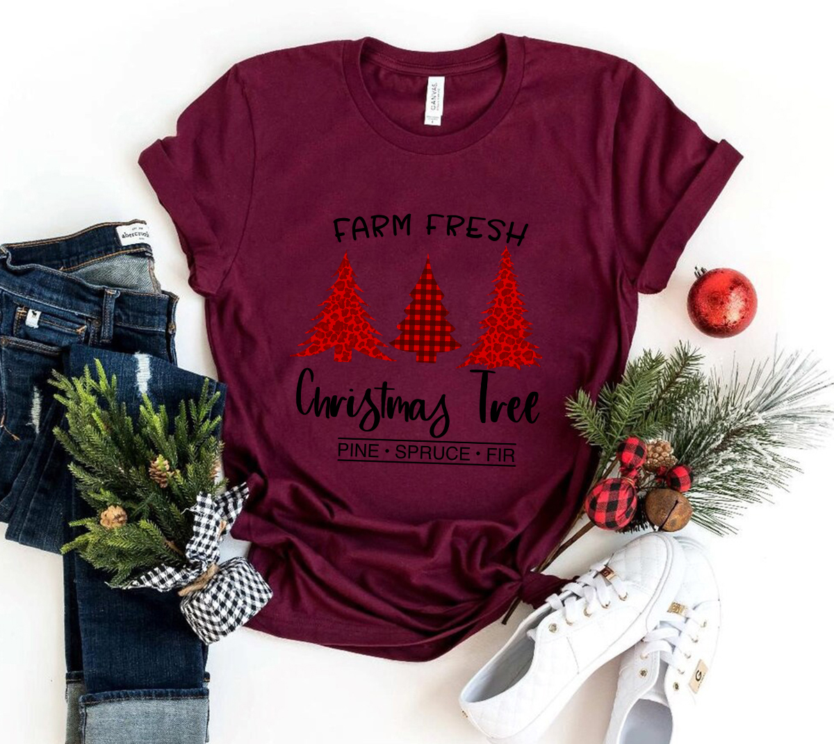 A festive unisex T-shirt featuring a Farm Fresh Christmas Tree design, made from soft ring-spun cotton, available in multiple colors.